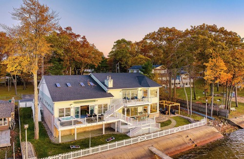 Prudenville House | 6BR Houghton Lake House w/Indoor Pool, Hot Tub, and Golf Simulator - Sleeps 24