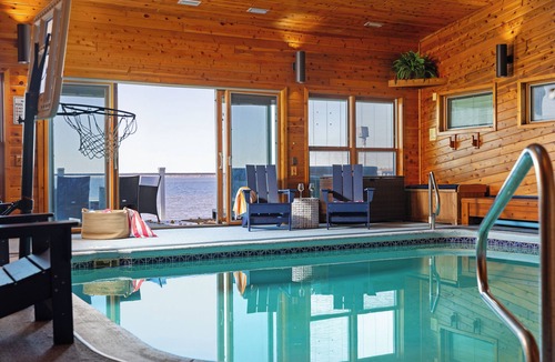 Prudenville House | 6BR Houghton Lake House w/Indoor Pool, Hot Tub, and Golf Simulator - Sleeps 24