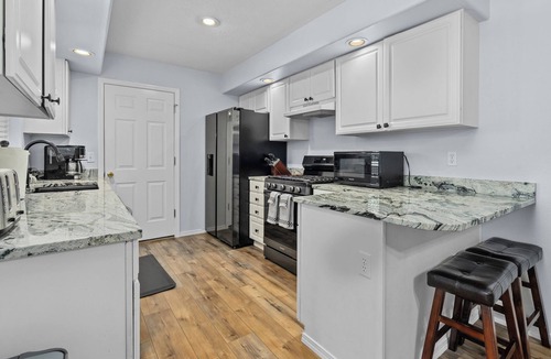 Keizer House | Inviting 2BR Half-Plex-Equipped Kitchen & Garage