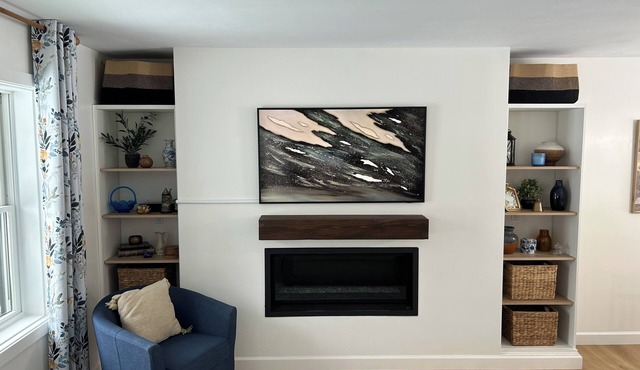 Cozy, newly renovated home with a gorgeous fireplace and office space.