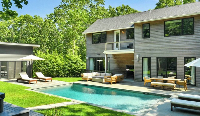Designer Gut Renovated Farmhouse on over 1 Acre, Numerous Spacious Living.