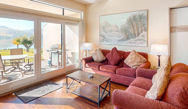 Lakefront condo with amazing views, pool, hot tub, beach access, and fireplace