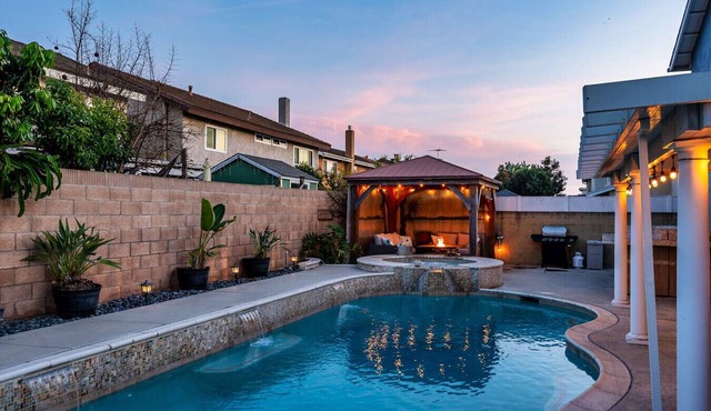 Private 4-bedroom pool home with 2 primary suites with heated pool, jacuzzi, fire pit, and outdoor dining. Minutes to Disneyland, Knott’s, and Orange County beaches.