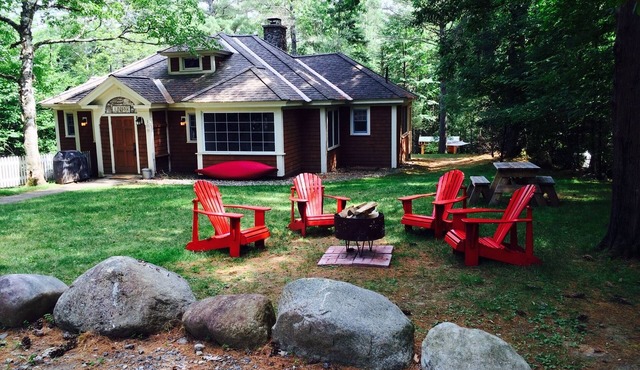Short walk to village.with private wooded setting. EV Charger in parking area.